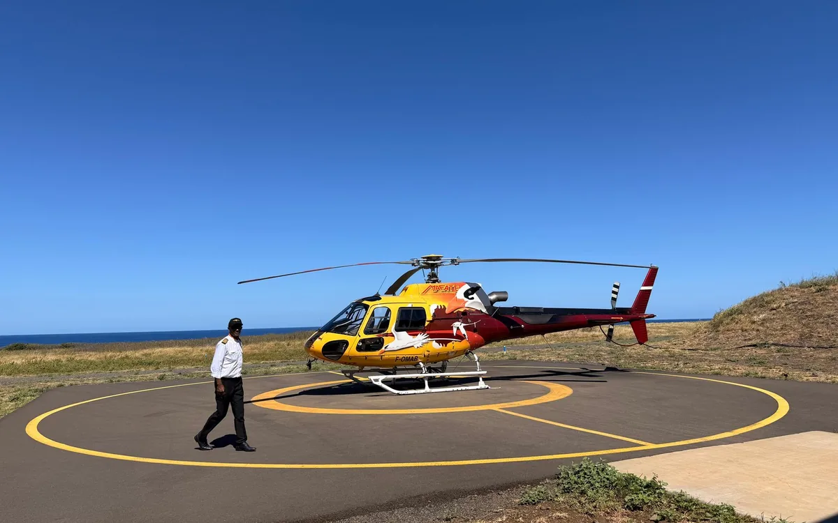 A helicopter on the pad at an airfield on Reunion Island